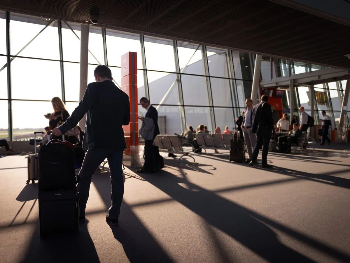 Business travellers in an airport terminal