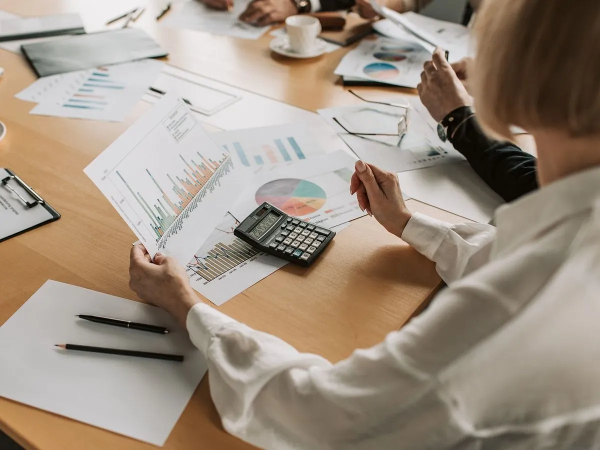 Finance team reviewing reports and charts in a meeting